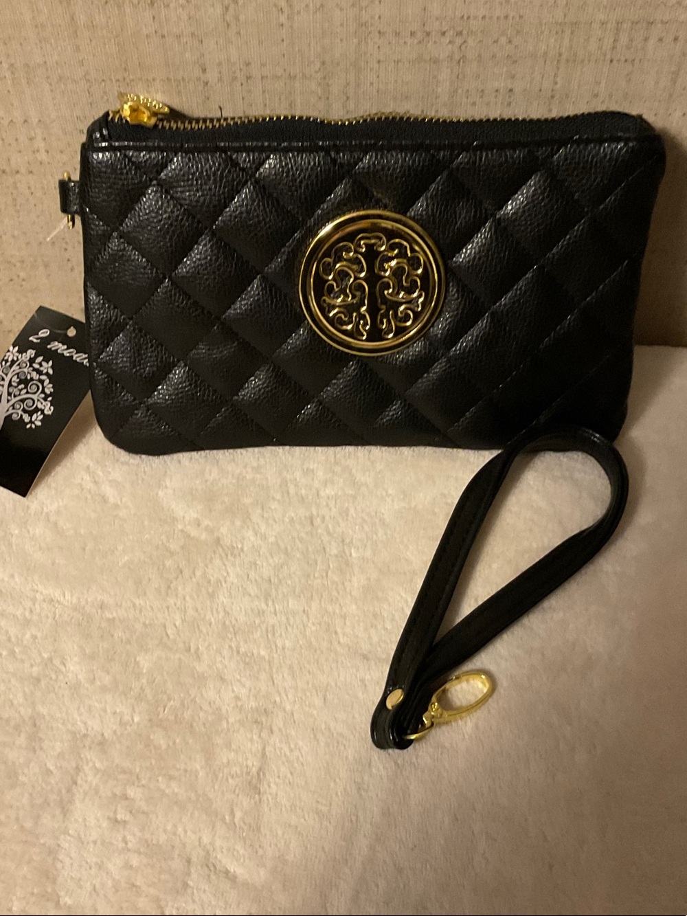 Black Quilted Wristlet Clutch with Gold Medallion